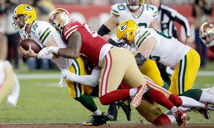 Buckner and his Niners teammates dropped Rodgers five times.